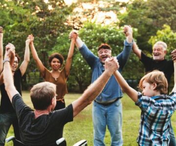 Diverse_community_group_holding_hands_web_1